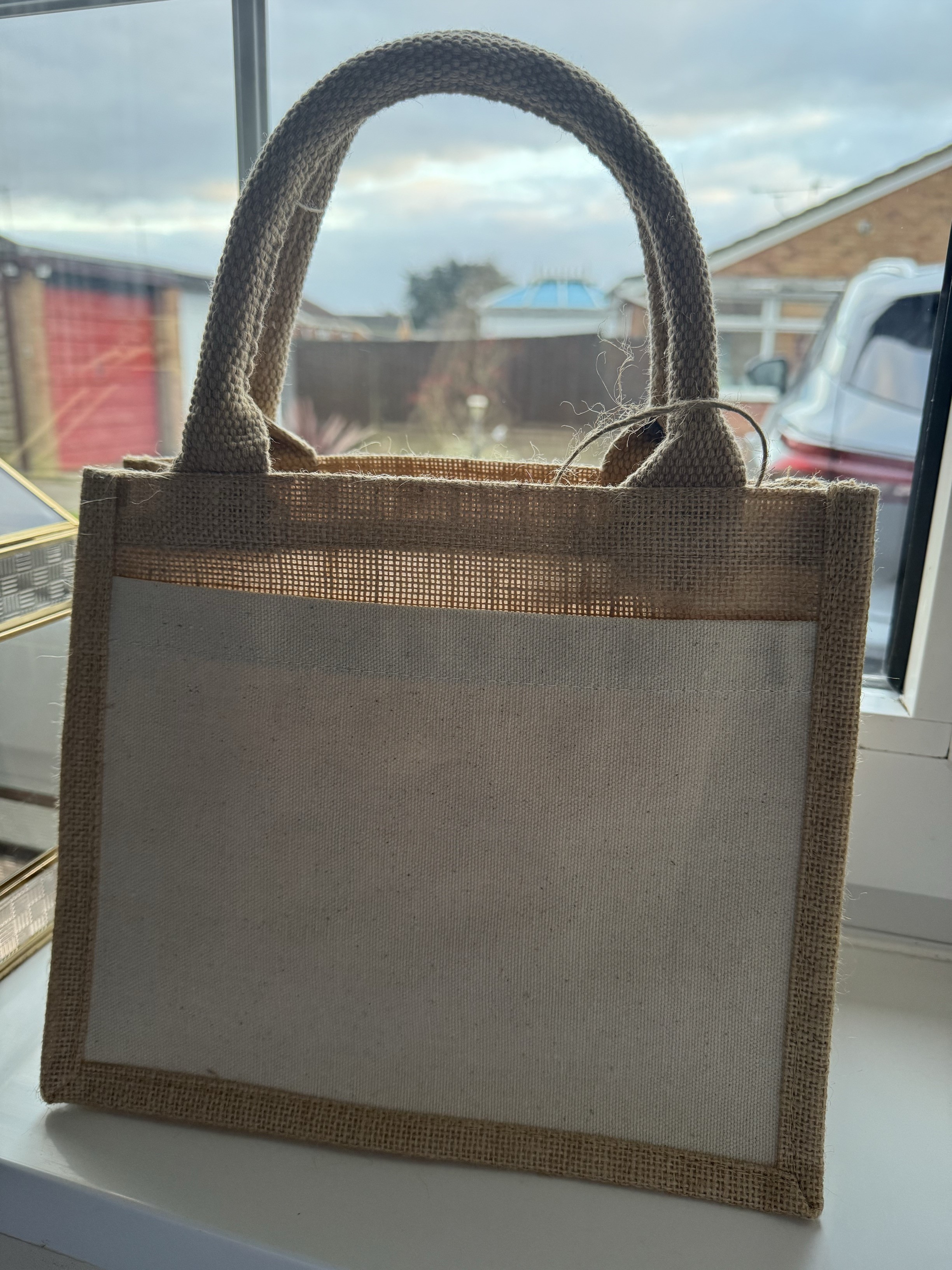 Small Jute Bag with a cotton pocket.'